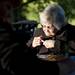 Willis resident Sybil Johnson personalizes a kite dedicated to her late husband, Leland, at the Fly and Remember kite decorating event at Gallup Park on Tuesday. Daniel Brenner I AnnArbor.com